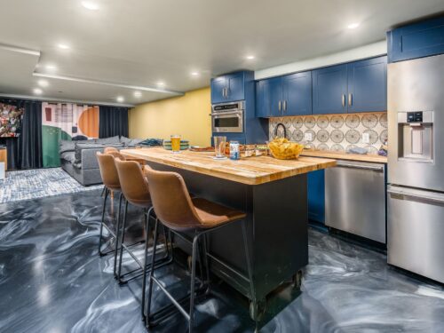 Basement remodel with dreamy epoxy floor and ultimate entertainment