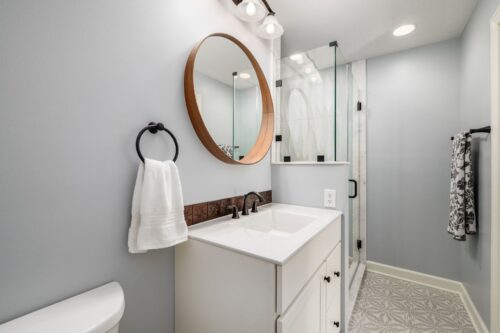 linen pattern floor tile with wavy shower walls