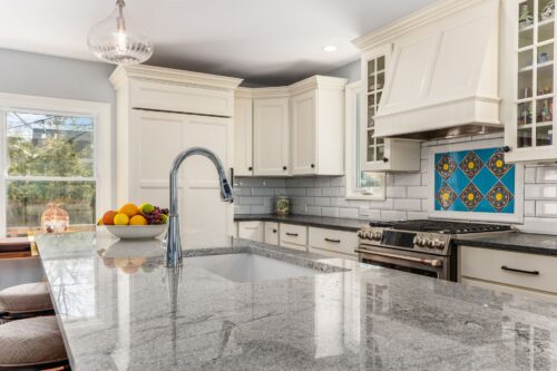 worthington kitchen remodel with intricate tile inlay and hidden fridge