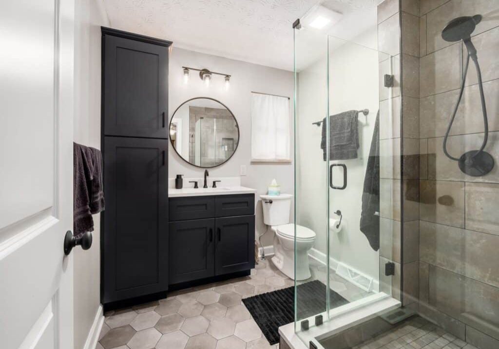 bathroom remodeling with masculine dark tones and upgraded shower