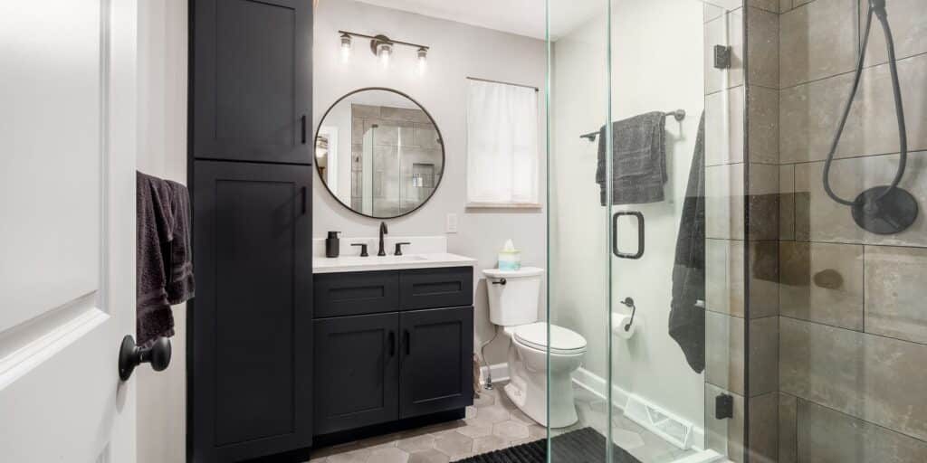 bathroom remodeling with masculine dark tones and upgraded shower