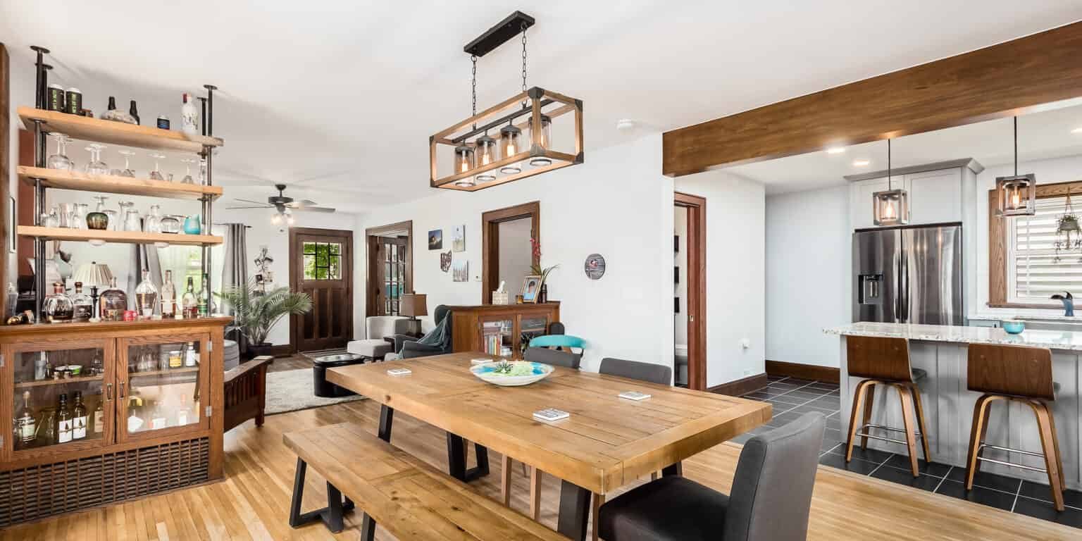 home remodel with beautiful wrapped beams and stylish home bar