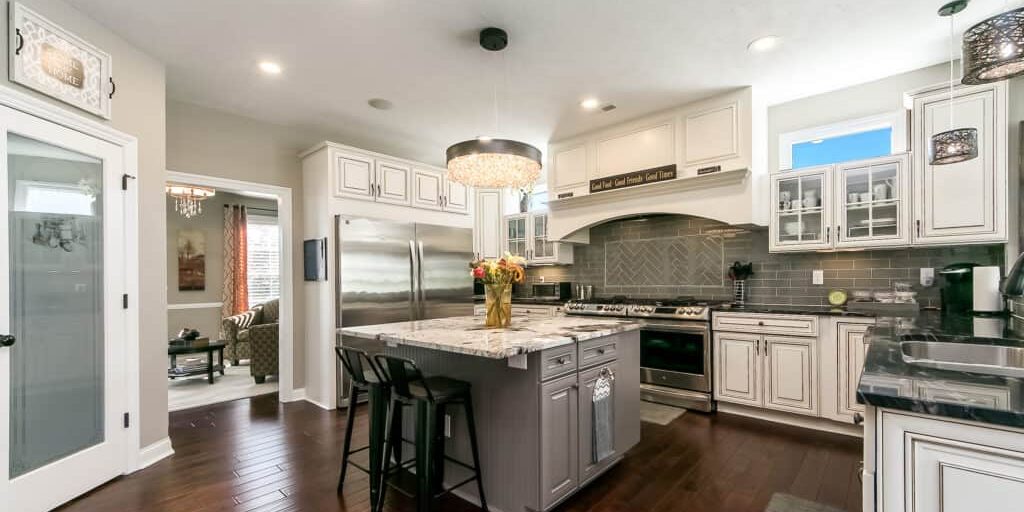 powell kitchen remodel with classy chandelier and glass backsplash