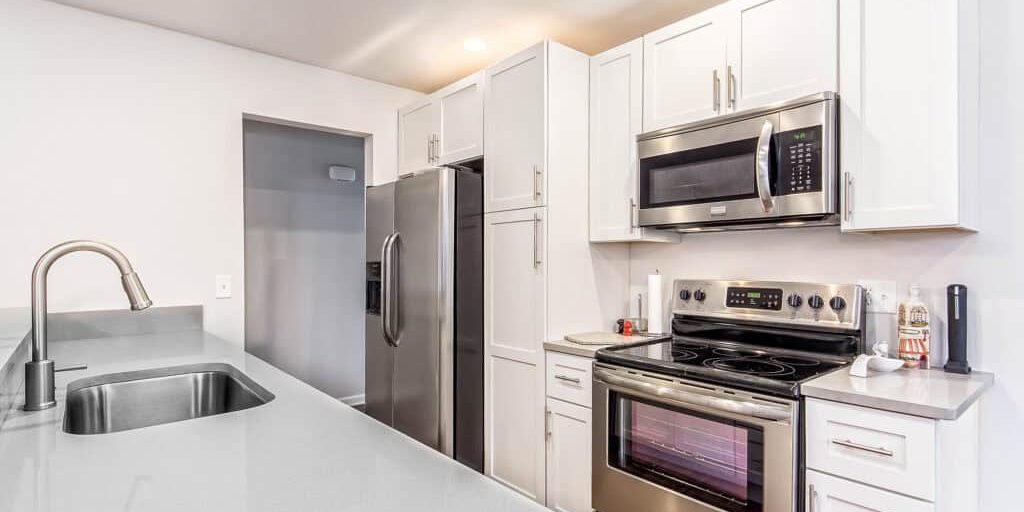 New Albany kitchen remodel with dreamy white quartz and apron sink from neighboring Westerville